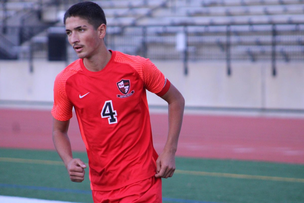 A close up of senior Roman Yoder during the game, running to help Blair.