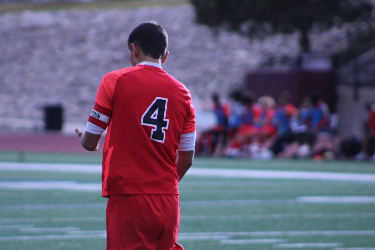 Senior Roman Yoder cleaning himself off after he dove into the goal and had a save. 