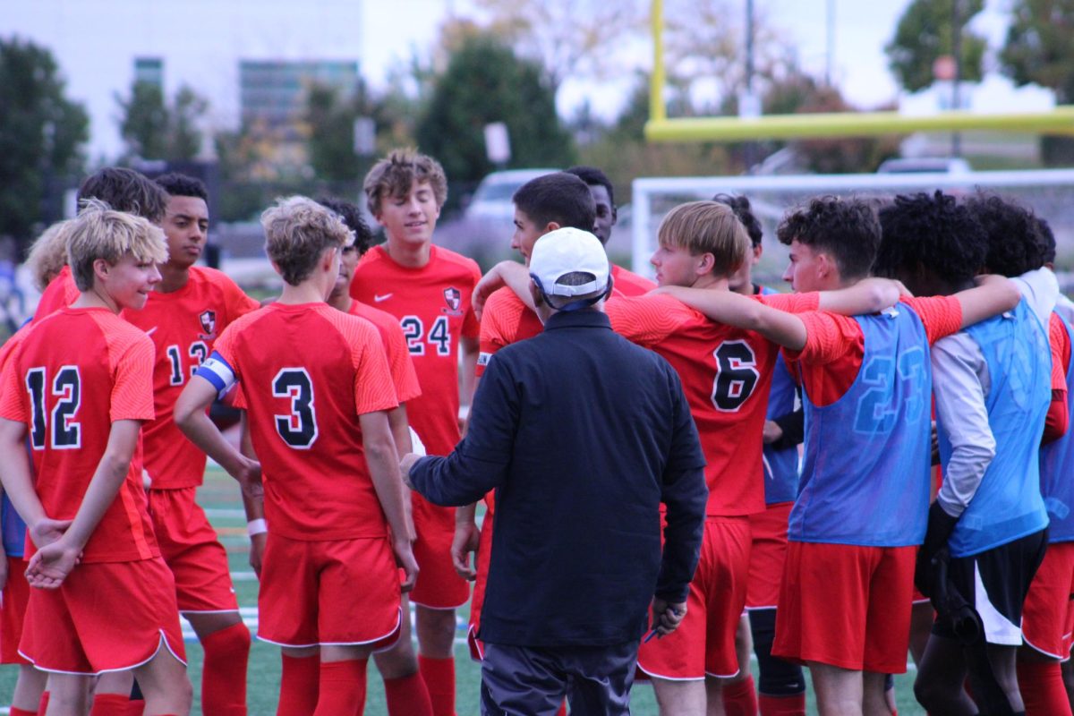 Coach Vergara talking with his team. 