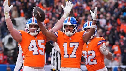 Broncos rookie wide receiver Devaughn Vele celebrates a touchdown grab with tight ends Adam Trautman and Nate Adkins during the team’s Week 18 38-0 victory over the Chiefs that clinched them a playoff spot.