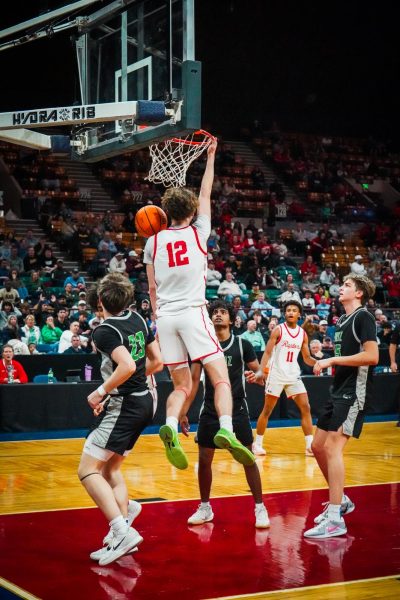 Senior Garret Barger taunting the other team after hitting a dunk. 