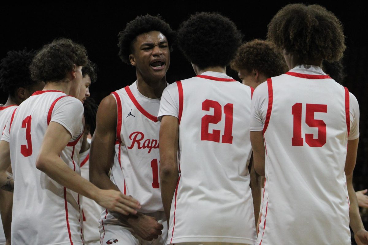 Sophomore Kris Coleman celebrates after hitting a three during the second quarter.