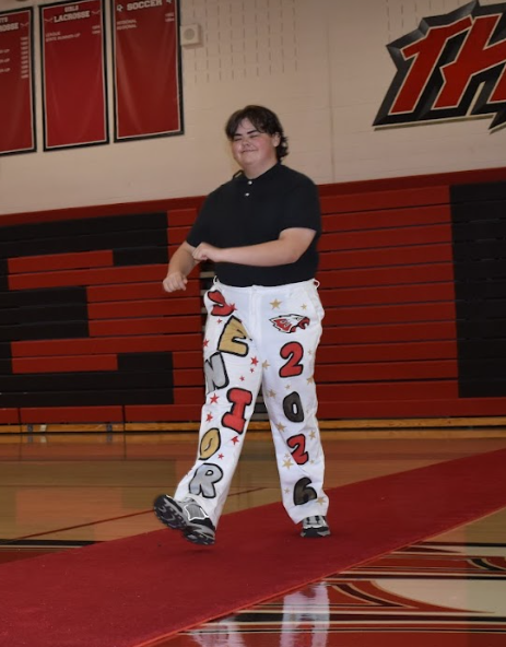 Jerry Reinhardt dosey-does his arms left and right down the carpet. "I really like the color scheme of the red white and black to show school pride," said Reinhardt.