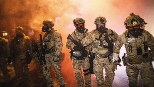 ICE agents fire tear gas, flash bangs, and pepper balls to suppress crowds of protestors in Minneapolis.